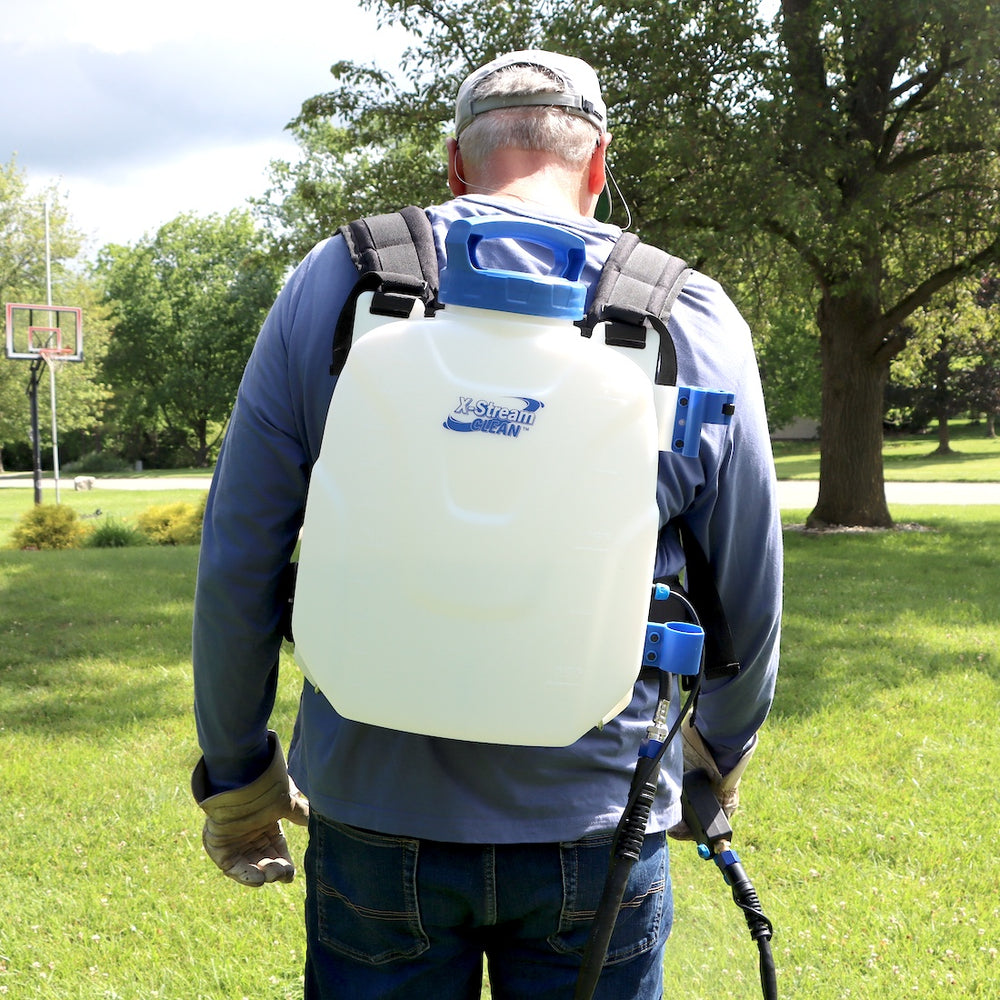 man wearing microburst 2.0 battery sprayer